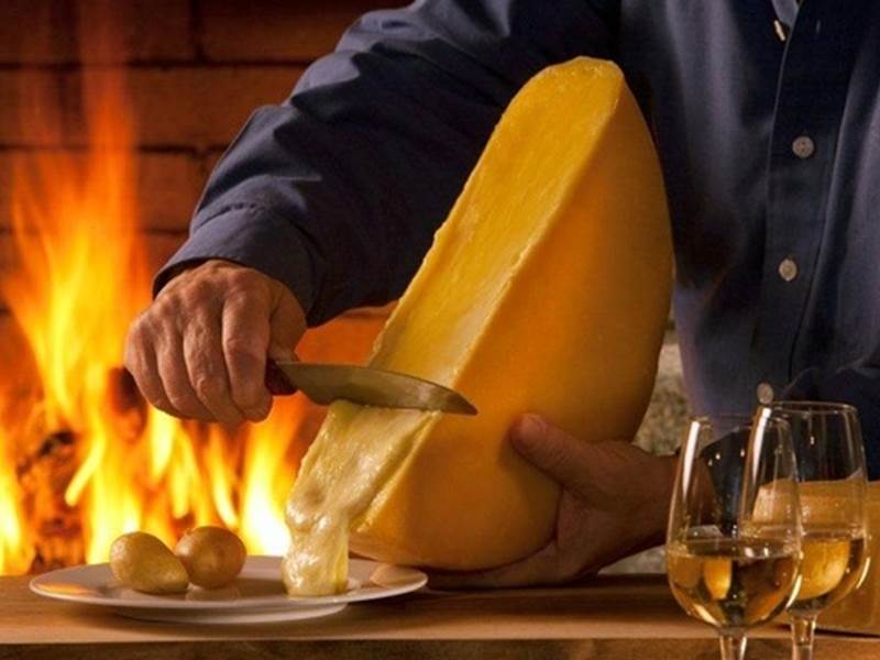 Hand carving raclette at your table