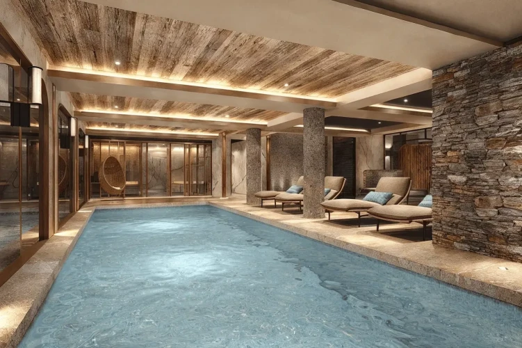 Shared indoor swimming pool for Apartment 101 with loungers, stone walls and spa-style interior